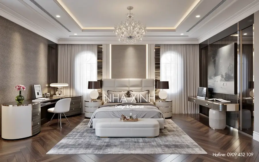 Phòng làm việc với bàn gỗ chạm khắc và giá sách lớn sát tường.
