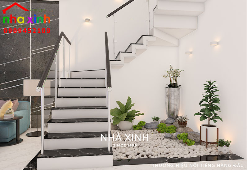 Tiểu cảnh cây xanh trang trí góc cầu thang đem lại thẩm mỹ cao cho mẫu thiết kế nội thất nhà phố đẹp