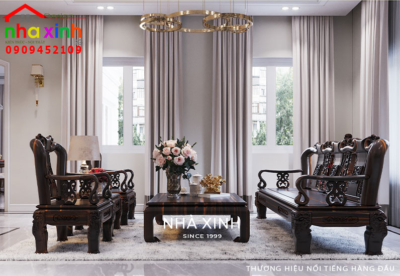 Bộ sofa bằng gỗ chạm khắc hoa văn tỉ mỉ là điểm nhấn trong không gian phòng khách 